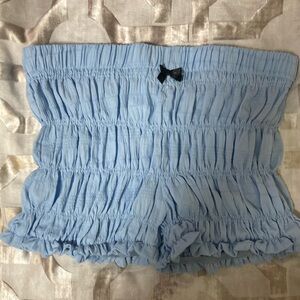 Light blue stretchy shorts with a small cute black bow.